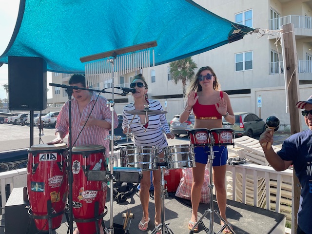 Friends and family playing bongos at Coco's